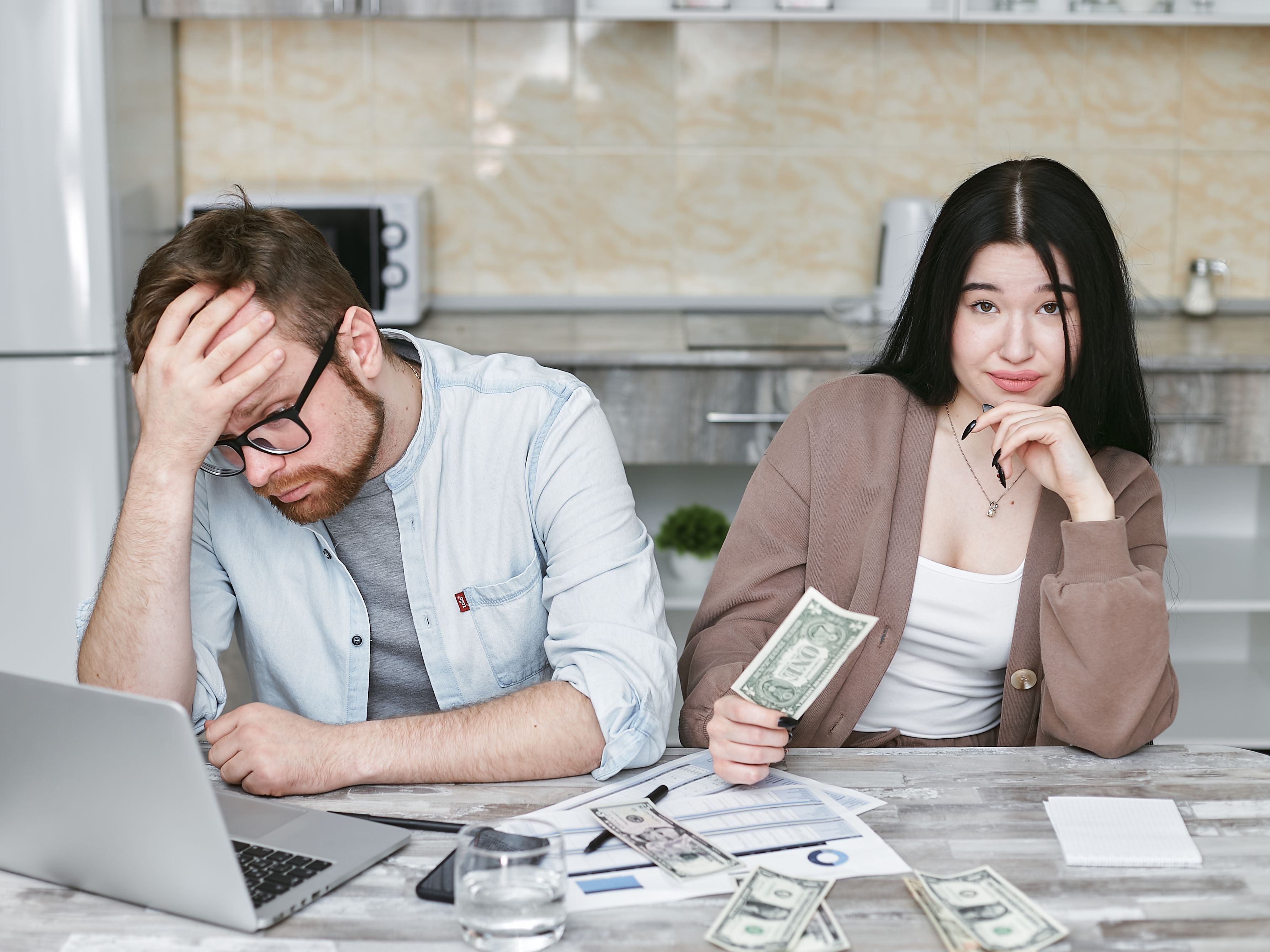 Couple reviewing a household budget and finances during an inflation crisis