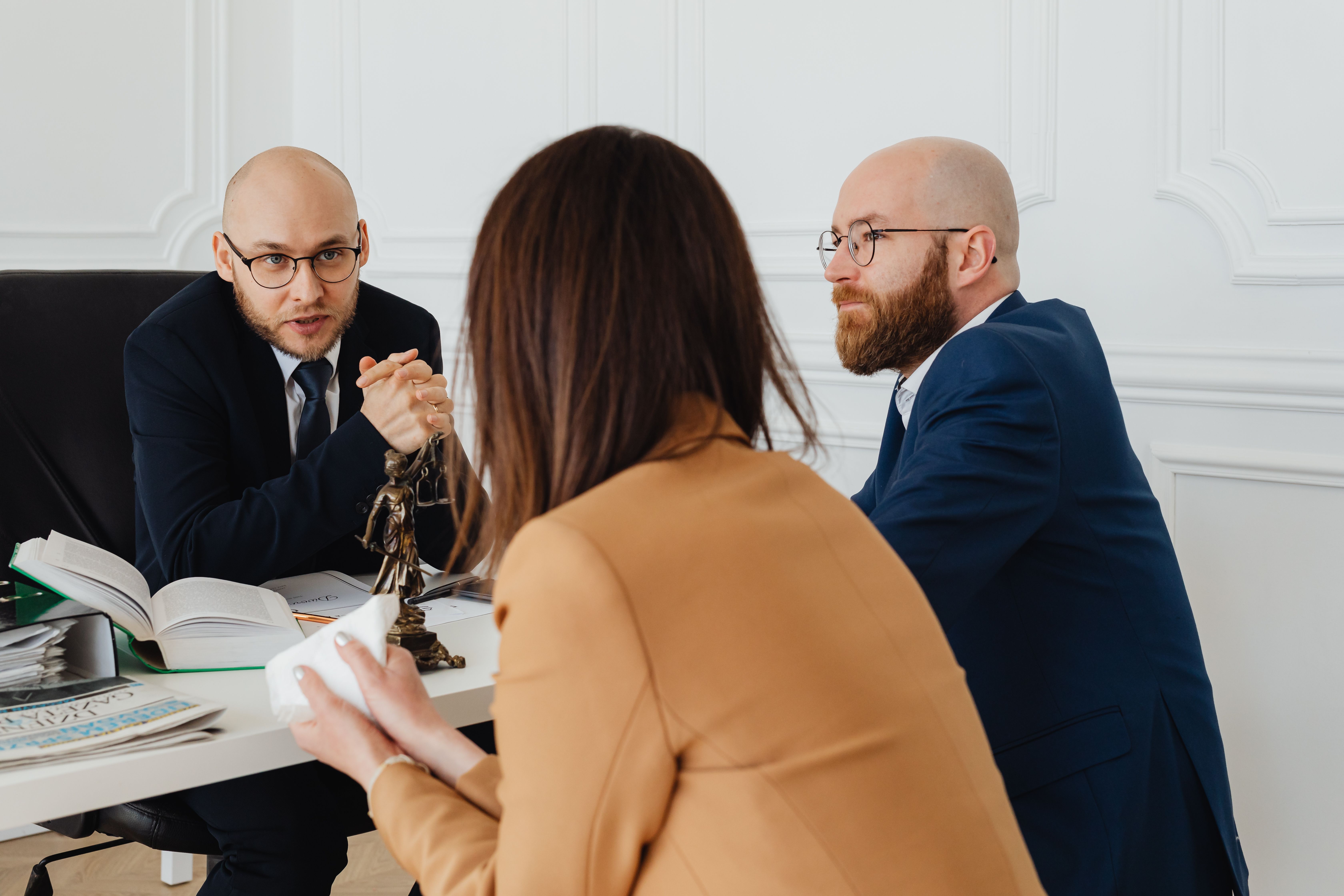 Lawyers in a modern office discussing legal strategy during a consultation