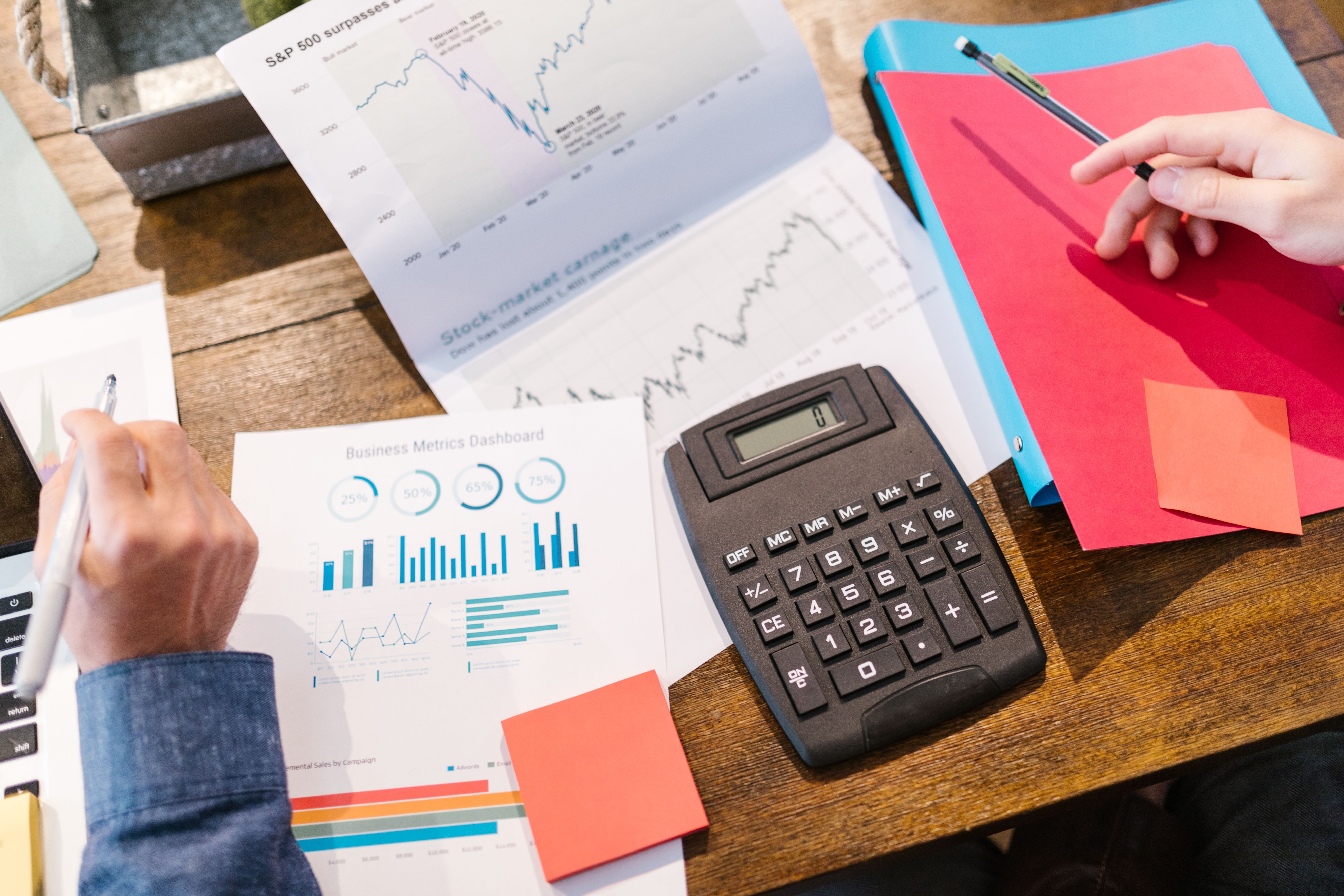 Financial analysis tools, charts, and calculator representing litigation investment assessment